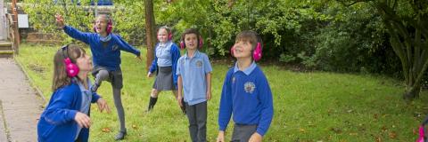 Now Press Play Earphones in use outside on the playground